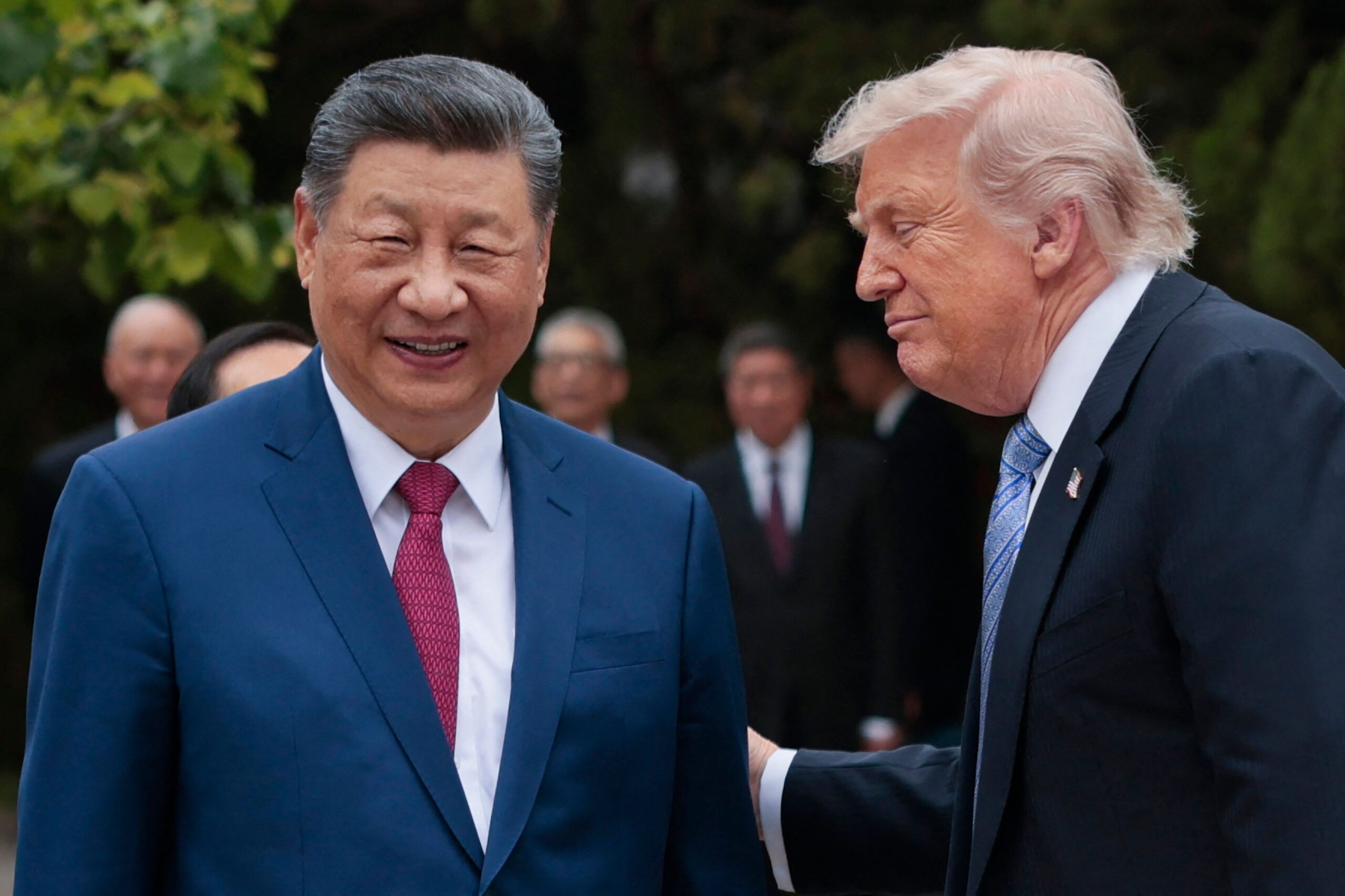US President Donald Trump (R) speaks with China’s President Xi Jinping as he leaves after a visit to Zhongnanhai Garden in Beijing on May 15, 2026. (Photo by Evan Vucci / POOL / AFP)
